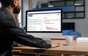 Man looking at FORS Emissions calculator on his Mac desktop screen. 